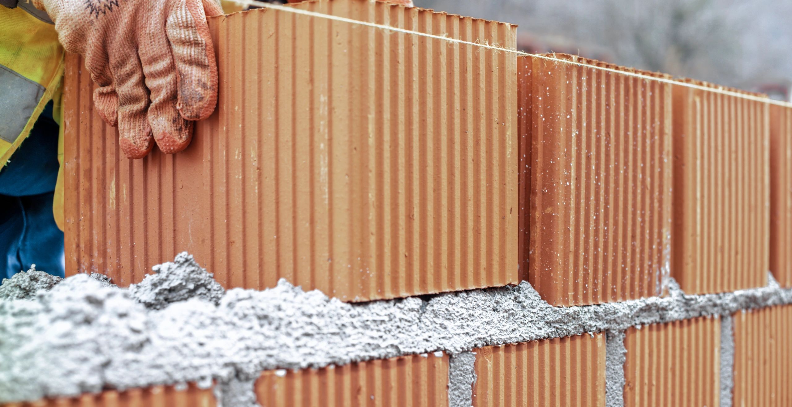 Home Manual worker building brick wall