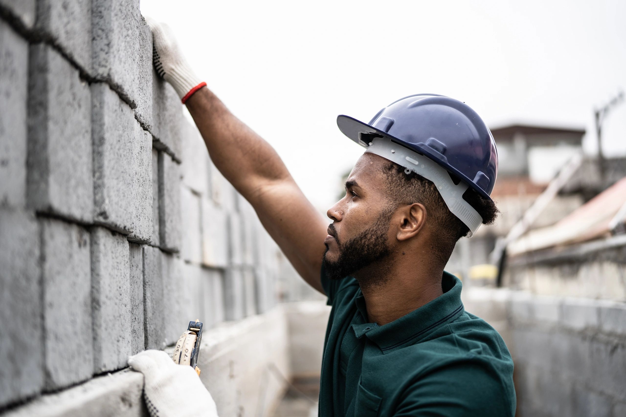 Bricklayer laying bricks on a construction site