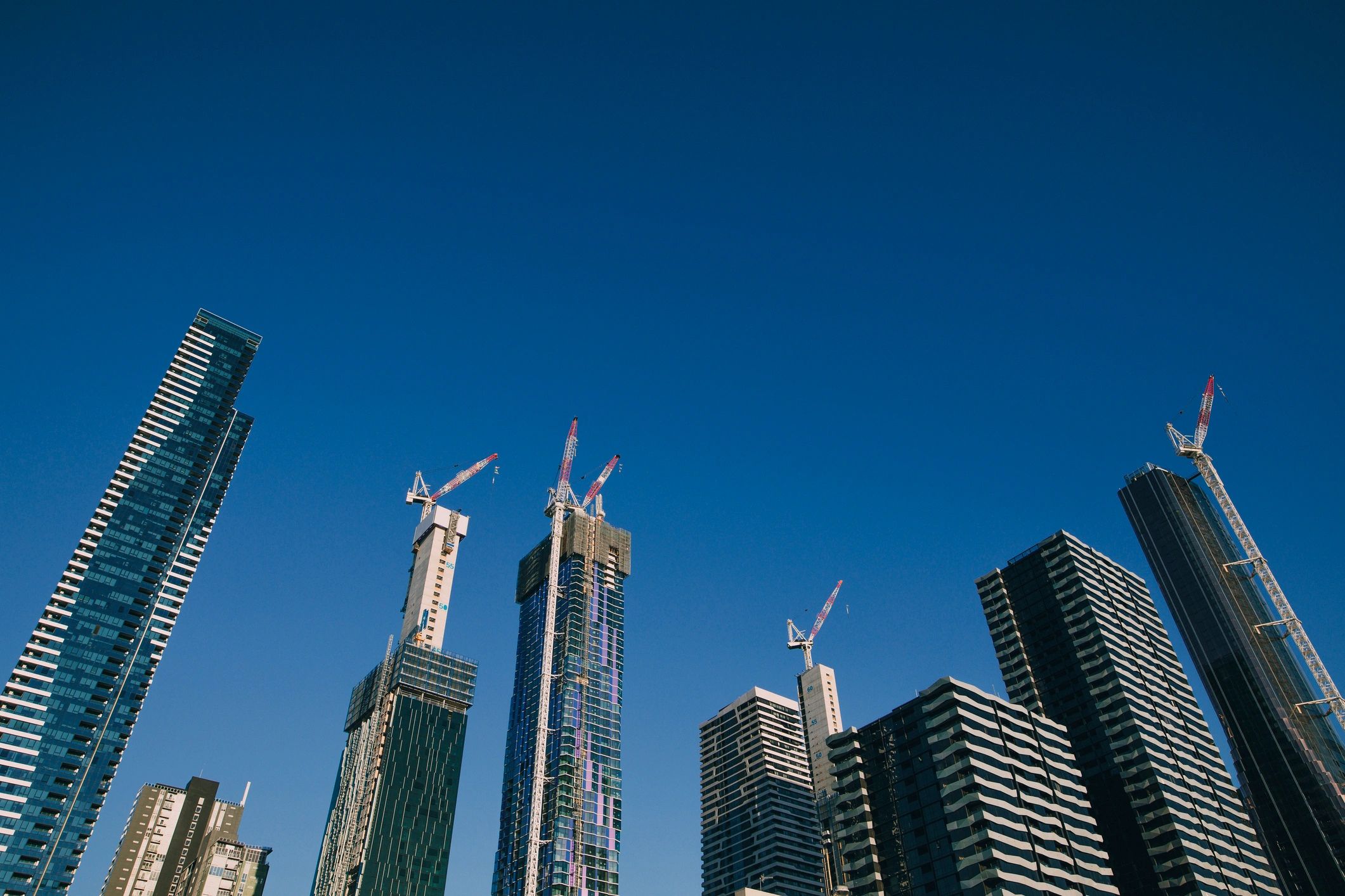 Melbourne skyline with construction cranes at sunset